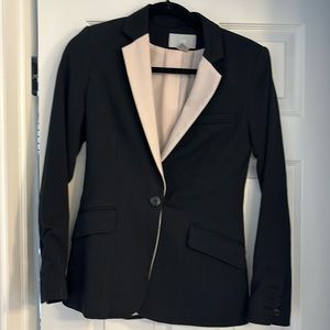 Women’s black blazer with light pink lining